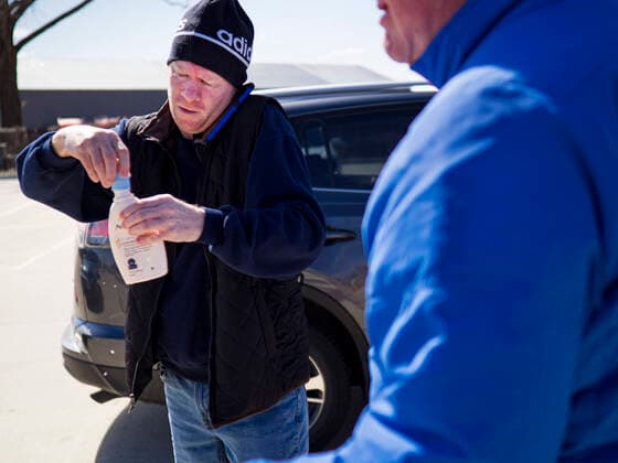 March 20, 2020, Des Moines, Iowa, U.S: A man caps a bottle of hand sanitizer he got at the Foundry, a distillery in Des Moines. The distillery suspended its distilling operations to make hand sanitizer this week. They distributed it free to people who came to their building. On Friday thousands of people came to get some. There line was more than one mile long. On Friday morning, 20 March, Iowa reported 45 confirmed cases of the Coronavirus. Restaurants, bars, movie theaters, places that draw crowds are closed for at least 30 days. There are no shelter in place orders in effect anywhere in Iowa but people are being encouraged to practice social distancing and many businesses are requiring or encouraging employees to telecommute. Des Moines U.S. - ZUMAk94_ 20200320_zaf_k94_018 Copyright: xJackxKurtzx