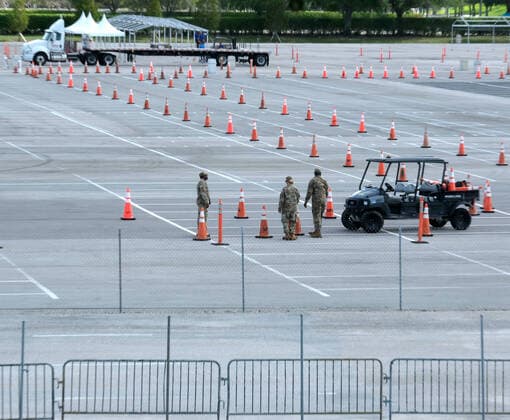 The Army Corps of Engineers set up a parking lot for Coronavirus testing and staging of the Florida National Guard at the Hard Rock Stadium on Friday, March 20, 2020 in Miami, Florida. This test site is scheduled to handle Miami area residents to help identify the Coronavirus Pandemic.  MIA20200320102 GARYxIxROTHSTEIN