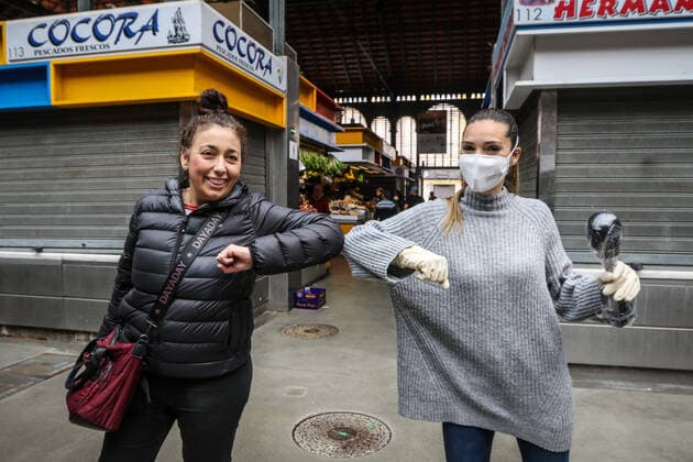 March 20, 2020: March 20, 2020 (Malaga) Two girls greet each other with their elbows, as a hygiene measure to prevent Coronavirus infection. - ZUMAc161 20200320_zap_c161_032 Copyright: xLorenzoxCarnerox