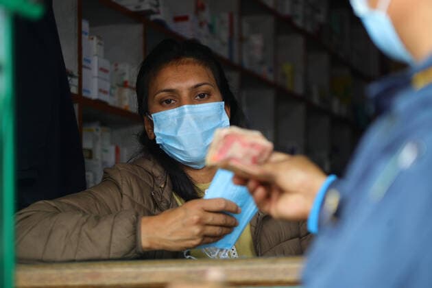 Impact of COVID-19 at Kathmandu Pharmacists selling face mask to the public at the Sajha Shwashthya Sewa drug store run by the Government of Nepal in Kathmandu, Nepal on Friday, March 20, 2020. Government selling masks which were seized from different places by Nepal Police during the Corona virus (COVID-19) outbreak. Kathmandu Bagmati Nepal Copyright: SubashxShrestha