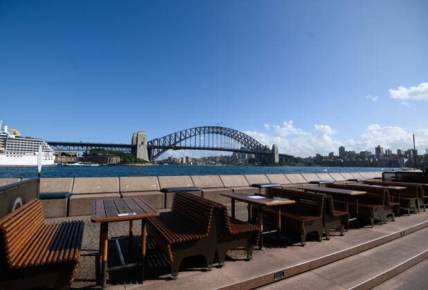 CORONAVIRUS AUSTRALIA, Empty tables at the Opera Bar restaurant, Sydney, Saturday, March 21, 2020. Sydney is seeing a dramatic reduction in people on the streets as people are asked to enact social distancing and self isolation in order to prevent the spread of Covid-19. ( NO ARCHIVING, EDITORIAL USE ONLY, NO USE IN BOOKS WITHOUT CONSENT SYDNEY NSW AUSTRALIA  Copyright: xJAMESxGOURLEYx 20200321001458535426