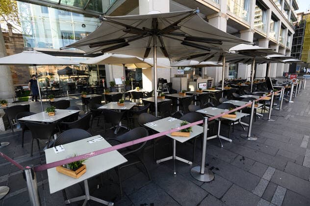CORONAVIRUS AUSTRALIA, Empty tables at a restaurant in Circular Quay, Sydney, Saturday, March 21, 2020. Sydney is seeing a dramatic reduction in people on the streets as people are asked to enact social distancing and self isolation in order to prevent the spread of Covid-19. ( NO ARCHIVING, EDITORIAL USE ONLY, NO USE IN BOOKS WITHOUT CONSENT SYDNEY NSW AUSTRALIA  Copyright: xJAMESxGOURLEYx 20200321001458535643