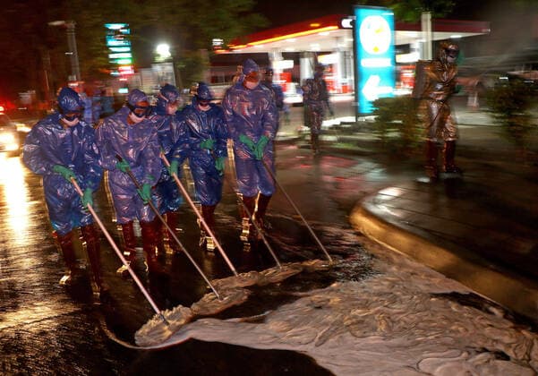 March 20, 2020, Bangkok, Thailand: Thai soldiers clean and spray disinfectant at main street during a precaution against the coronavirus Covid-19 outbreak in Bangkok on March 21, 2020. Total number of deaths stemming from the growing pandemic at 11,000. The number of people infected worldwide is nearing 257,000 with most cases in China, followed by Italy and Iran, according to its data. Bangkok Thailand - ZUMAu103 20200320_zia_u103_011 Copyright: xUrdeexImagex