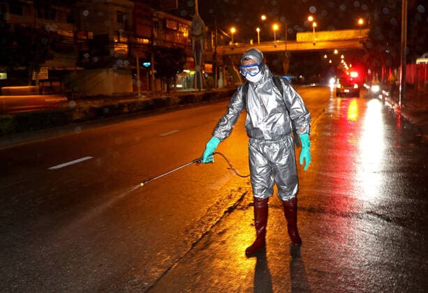 March 21, 2020, Bangkok, Thailand: Thai soldiers spray disinfectant at main street during a precaution against the coronavirus Covid-19 outbreak in Bangkok on March 21, 2020. Total number of deaths stemming from the growing pandemic at 11,000. The number of people infected worldwide is nearing 257,000 with most cases in China, followed by Italy and Iran, according to its data. Bangkok Thailand - ZUMAu103 20200321_zia_u103_001 Copyright: xUrdeexImagex