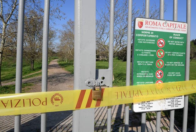 (200321) -- ROME, March 21, 2020 (Xinhua) -- One of the entrances of Villa Phamphili is closed in Rome, Italy, March 20, 2020. Italy s Ministry of Health on Friday took the unprecedented step of closing all public parks, gardens and other open spaces, effective from Saturday. The coronavirus pandemic has claimed 4,032 lives in locked down Italy by Friday, with the number of cumulative cases reaching 47,021, according to new data released by the Civil Protection Department. (Photo by Alberto Lingria Xinhua) ITALY-COVID-19-LOCKDOWN
