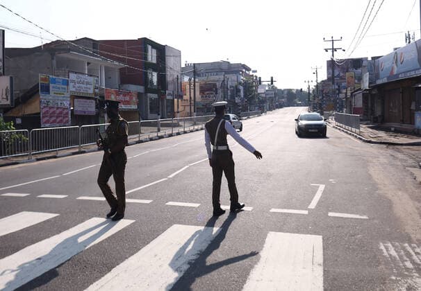 March 21, 2020, Colombo, Sri Lanka: Police check a car in the empty street is seen after the authorities announced a weekend curfew in country as a preventive measure against the spread of the COVID-19 novel coronavirus, in Colombo March 21, 2020. Colombo Sri Lanka - ZUMAd152 20200321_znp_d152_003 Copyright: xPradeepxDambaragex