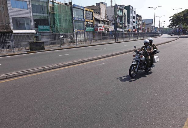 March 21, 2020, Colombo, Sri Lanka: A Sri Lankan police officer rides a motercycle an empty street is seen after the authorities announced a weekend curfew in a country as a preventive measure against the spread of the COVID-19 novel coronavirus, in Colombo March 21, 2020. Colombo Sri Lanka - ZUMAd152 20200321_znp_d152_008 Copyright: xPradeepxDambaragex
