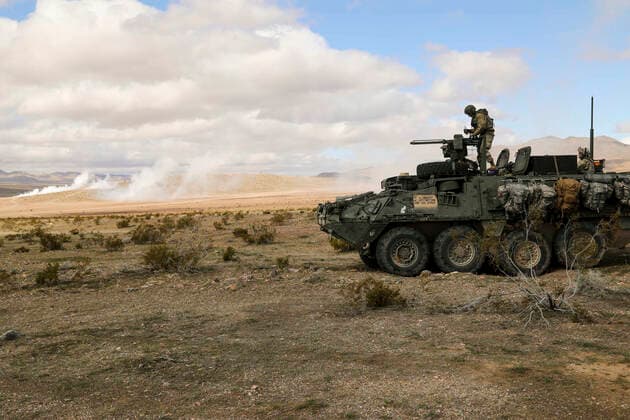 March 15, 2020 - Fort Irwin, California, USA - Soldiers assigned to Second Squadron, Third Infantry Regiment, 1st Stryker Brigade Combat Team, 2nd Infantry Division, Joint Base Lewis-McChord Wa., oils an M2 machine gun on a M1135 Stryker during Decisive Action Rotation 20-05 at the National Training Center in Fort Irwin, California, March 14, 2020. Decisive Action Rotations at the National Training Center ensure Army Brigade Combat Teams remain versatile, responsive, and consistently available for current and future contingencies Fort Irwin United States - ZUMAz03_ 20200315_sha_z03_896 Copyright: xU.S.xArmyx