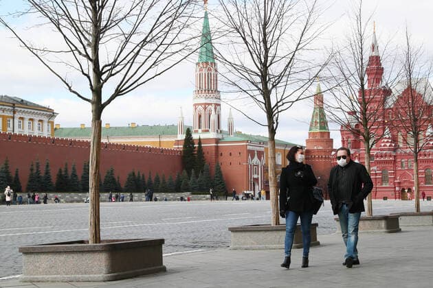 MOSCOW, RUSSIA - MARCH 21, 2020: People walking in Red Square. Alexander Shcherbak TASS  TS0D2F2E