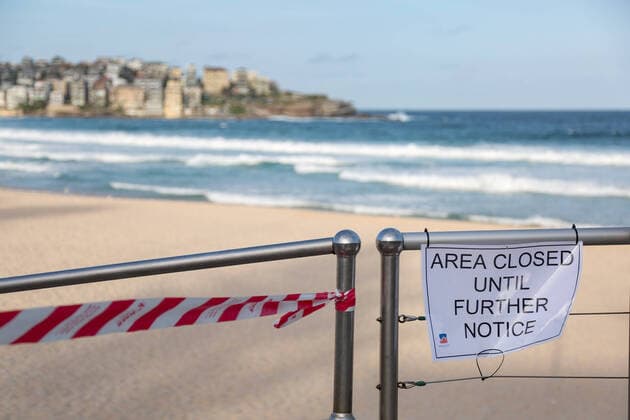 (200321) -- SYDNEY, March 21, 2020 -- Photo taken on March 21, 2020 shows the Bondi Beach closure notice in Sydney, Australia. Australia s iconic Bondi Beach was closed after hundreds of beachgoers crowded on the sand on Friday ignoring the ongoing social distancing guidelines. Police Minister of the State of New South Wales David Elliott ordered the beach in Sydney to be shut down on Saturday afternoon. There have been 874 confirmed cases of COVID-19 in Australia as of 6:30 a.m. local time Saturday, among which there are 382 in the State of New South Wales. Seven people have died from the disease. ) AUSTRALIA-SYDNEY-COVID-19-BONDI BEACH-CLOSE BaixXuefei 