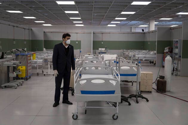 March 21, 2020, Tehran, Iran: Iranian workers set a temporary established emergency hospital in a part of the world s largest shopping mall complex called Iran Mall , to treat patients infected with the COVID-19 disease, caused by the SARS-CoV-2 coronavirus, in the northwest of the capital of Tehran, Iran. Iran is one of the countries most affected by the devastating pandemic of the coronavirus. According to the latest report by the Ministry of Health, there are at least 20,610 confirmed cases of coronavirus infections and 1,556 people have died from the virus throughout Iran. Tehran Iran - ZUMAf146 20200321_zip_f146_026 Copyright: xRouzbehxFouladix