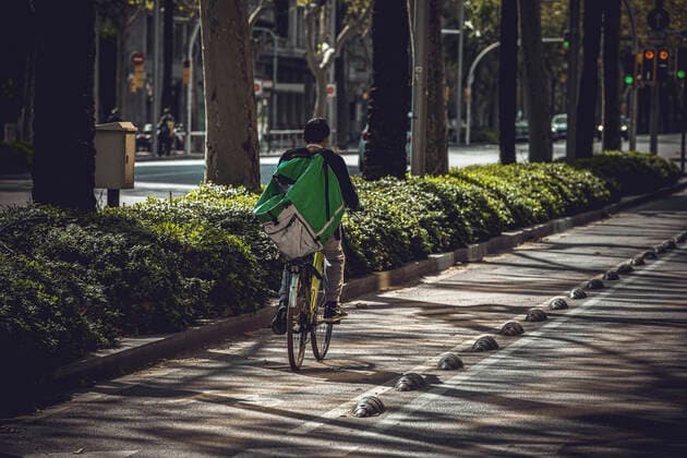 March 21, 2020: A bike courier rides along the usually bustling Diagonal Avenue at the end of the first week of a nationwide lockdown due to the continuous spread of the COVID-19 virus. Spain has entered the worst phase of this disease so far counting more than thousand deaths with no end at sight. - ZUMAo105 20200321_zap_o105_011 Copyright: xMatthiasxOesterlex