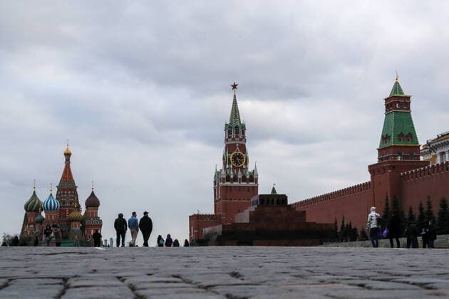 MOSCOW, RUSSIA - MARCH 21, 2020: People walk in Red Square near St Basil s Cathedral. As of 21 March 2020, Russia has confirmed more than 250 cases of the novel coronavirus, with more than 130 cases in Moscow. Sergei Savostyanov TASS  TS0D3004