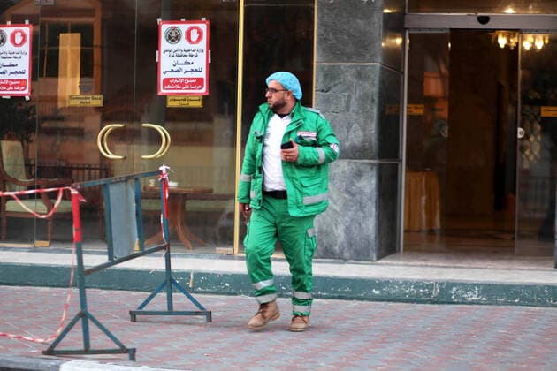 March 21, 2020, Gaza City, Gaza Strip, Palestinian Territory: A Palestinian man stands at the entrance of Commodore Gaza Hotel, after preventive measures are taken against the coronavirus, in Gaza city on March 21, 2020. Gazans may be trying to make light of coronavirus on social media, comparing lockdowns to the Israeli blockade, but fears are growing of a disastrous outbreak in the Palestinian territory. With movement in and out of the territory severely restricted since long before the pandemic emerged, the Gaza Strip is perhaps one of the few places on earth with a chance of staying virus-free Gaza City Palestinian Territory - ZUMAap3_ 20200321_zaf_ap3_031 Copyright: xMahmoudxAjjourx