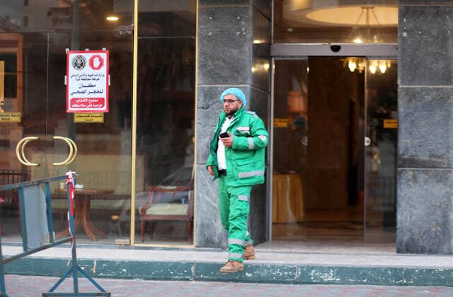 March 21, 2020, Gaza City, Gaza Strip, Palestinian Territory: A Palestinian man stands at the entrance of Commodore Gaza Hotel, after preventive measures are taken against the coronavirus, in Gaza city on March 21, 2020. Gazans may be trying to make light of coronavirus on social media, comparing lockdowns to the Israeli blockade, but fears are growing of a disastrous outbreak in the Palestinian territory. With movement in and out of the territory severely restricted since long before the pandemic emerged, the Gaza Strip is perhaps one of the few places on earth with a chance of staying virus-free Gaza City Palestinian Territory - ZUMAap3_ 20200321_zaf_ap3_034 Copyright: xMahmoudxAjjourx