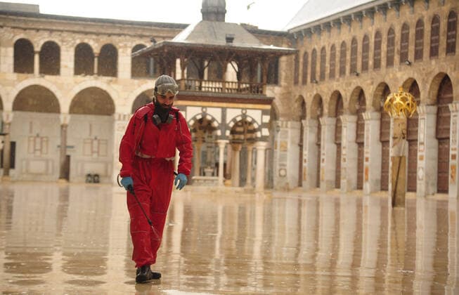 March 21, 2020, Damascus, Damascus, Syrian Arab Republic: Syrian workers disinfect the Great Umayyad Mosque, as a preventive measure amid fears of the spread of the coronavirus, in Damascus, Syria, on March 21, 2020. Even though no cases of coronavirus Covid-19 have yet been reported in the city, some people prefer to take precautionary measures Damascus Syrian Arab Republic - ZUMAap3_ 20200321_zaf_ap3_078 Copyright: xOmarxEstwanix