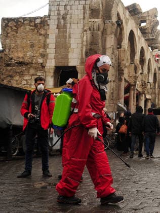 March 21, 2020, Damascus, Damascus, Syrian Arab Republic: Syrian workers disinfect the old market, as a preventive measure amid fears of the spread of the coronavirus, in Damascus, Syria, on March 21, 2020. Even though no cases of coronavirus Covid-19 have yet been reported in the city, some people prefer to take precautionary measures Damascus Syrian Arab Republic - ZUMAap3_ 20200321_zaf_ap3_065 Copyright: xOmarxEstwanix