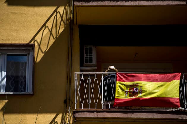 March 21, 2020, Granada, Spain: A man wearing a hat rests on his balcony during the corona virus pandemic..The state of emergency decreed a week ago in Spain does not allow citizens to leave their homes except for justified causes. Life on the balconies of houses and social distance in supermarkets are some of the effects of this measure to contain the spread of the COVID-19 virus. Granada Spain - ZUMAs197 20200321_zaa_s197_124 Copyright: xCarlosxGilx