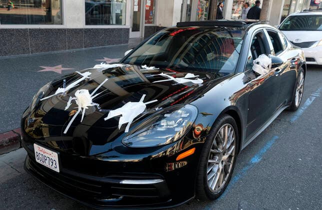 March 21, 2020, Los Angeles, California, U.S: A Porsche is decorated with toilet papers is seen on Hollywood Boulevard on Saturday, March 21, 2020, in Los Angeles. California Gov. Gavin Newsom issued a statewide stay-at-home order Thursday for residents to venture outside only for essential jobs, errands and some exercise, due to coronavirus concerns. Los Angeles U.S. - ZUMAc68_ 20200321_zaf_c68_015 Copyright: xRingoxChiux