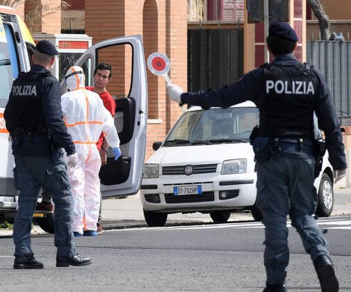 (200321) -- ROME, March 21, 2020 (Xinhua) -- Policemen are on duty in Ostia, Rome, Italy, March 21, 2020. Italy reported 6,557 new cases of coronavirus on Saturday, raising the total to 53,578 since the pandemic first broke out in its north on Feb. 21, according to the latest data provided by the Civil Protection Department managing the COVID-19 emergency. (Photo by Elisa Lingria Xinhua) ITALY-ROME-OSTIA-COVID-19-CASES 