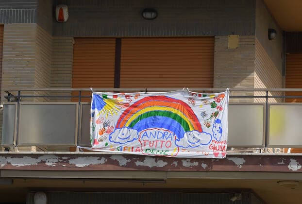 (200321) -- ROME, March 21, 2020 (Xinhua) -- A flag saying everything will be fine is seen on a balcony in Ostia, Rome, Italy, March 21, 2020. Italy reported 6,557 new cases of coronavirus on Saturday, raising the total to 53,578 since the pandemic first broke out in its north on Feb. 21, according to the latest data provided by the Civil Protection Department managing the COVID-19 emergency. (Photo by Elisa Lingria Xinhua) ITALY-ROME-OSTIA-COVID-19-CASES 