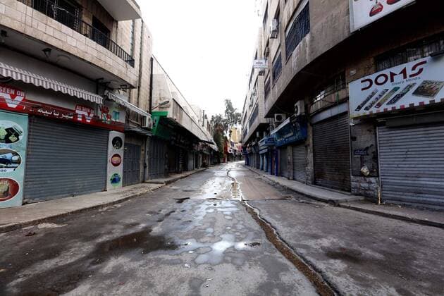 (200322) -- AMMAN, March 22, 2020 -- Photo taken on March 21, 2020 shows closed stores in the center of the Jordanian capital after the start of the nationwide curfew in Amman, Jordan. On March 21, Jordan started imposing a curfew as part of the measures to limit the spread of coronavirus. (Photo by Muhammad Abu Ghosh Xinhua) JORDAN-AMMAN-COVID-19-CURFEW MohammadxAbuxGhosh 