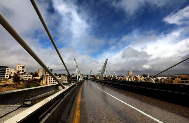 (200322) -- AMMAN, March 22, 2020 -- Photo taken on March 21, 2020 shows an empty bridge after the start of the nationwide curfew in Amman, Jordan. On March 21, Jordan started imposing a curfew as part of the measures to limit the spread of coronavirus. (Photo by Muhammad Abu Ghosh Xinhua) JORDAN-AMMAN-COVID-19-CURFEW MohammadxAbuxGhosh 