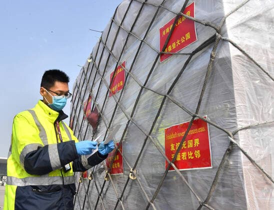 (200322) -- ZHENGZHOU, March 22, 2020 -- A staff member prepares to load donated materials onto a cargo plane at Xinzheng International Airport in Zhengzhou, capital of central China s Henan Province, March 22, 2020. The first batch of medical supplies donated by China s Henan Province, including 500,000 surgical masks and 100,000 pairs of medical gloves, departed from Zhengzhou on Sunday for Luxembourg by direct airline along the Air Silk Road linking Luxembourg with Zhengzhou to help Luxembourg fight the COVID-19. ) CHINA-HENAN-COVID-19-LUXEMBOURG-DONATED MATERIALS-DEPARTURE (CN) LixJianan 