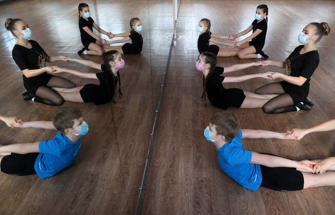 IVANOVO, RUSSIA - MARCH 22, 2020: Children wearing face masks during a class at a dance studio during the COVID-19 coronavirus pandemic. Vladimir Smirnov TASS  TS0D3045