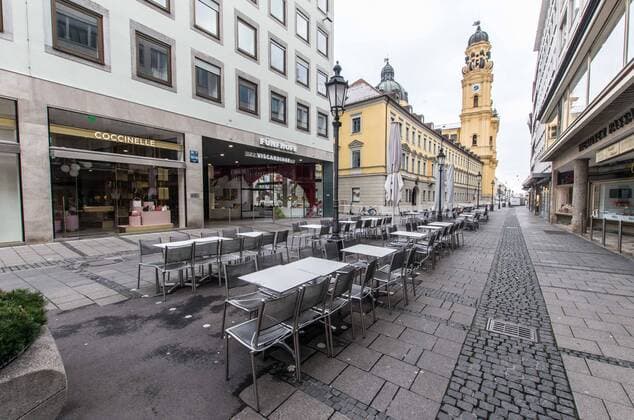 March 22, 2020, Munich, Bavaria, Germany: Tables and chairs outside of restaurants and cafes still locked due to a ban on gastronomie establischments. Displays of the empty streets and city center of Munich, Germany after restrictions on public life were put into force. The Interior Ministry has stated that cold weather, rain, and snow is a positive in this case. In comparison to a complete ban, Bavaria still allows highly restricted movement outside of the home and police are prepared act against violations. Munich Germany - ZUMAb160 20200322_zbp_b160_058 Copyright: xSachellexBabbarx