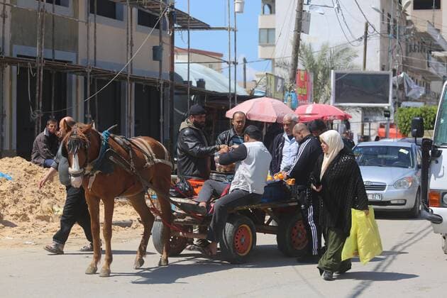 March 22, 2020, Deir Al-Balah, The Gaza Strip, Palestine: Palestinians at Deir al-Balah city market in central of the Gaza Strip, Markets of the Gaza strip are witnessing an increase in demand after announce first two cases of coronavirus in the Gaza Strip. Deir Al-Balah Palestine - ZUMAq100 20200322_zaa_q100_010 Copyright: xMahmoudxKhattabx