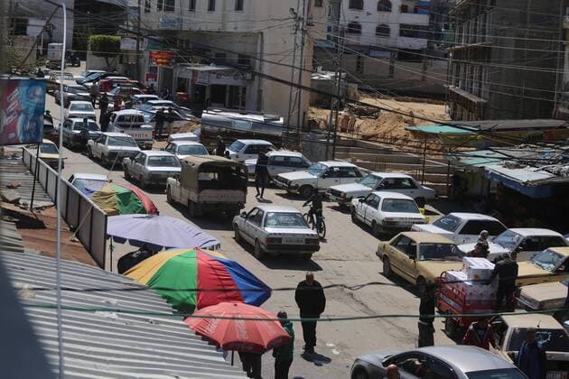March 22, 2020, Deir Al-Balah, The Gaza Strip, Palestine: Palestinians at Deir al-Balah city market in central of the Gaza Strip, Markets of the Gaza strip are witnessing an increase in demand after announce first two cases of coronavirus in the Gaza Strip. Deir Al-Balah Palestine - ZUMAq100 20200322_zaa_q100_023 Copyright: xMahmoudxKhattabx
