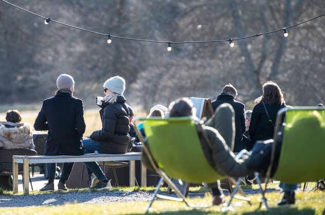 People enjoy the sunny but chilly weather at an outdoor restaurant at Djurgarden in Stockholm, Sweden, on March 22, 2020, amidst the new coronavirus COVID 19 pandemic Stockholm SWEDEN x10040x,  Copyright: xAndersxWiklund TTx SWEDEN WEATHER