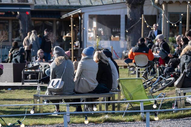 People enjoy the sunny but chilly weather at an outdoor restaurant at Djurgarden in Stockholm, Sweden, on March 22, 2020, amidst the new coronavirus COVID 19 pandemic Stockholm SWEDEN x10040x,  Copyright: xAndersxWiklund TTx SWEDEN WEATHER