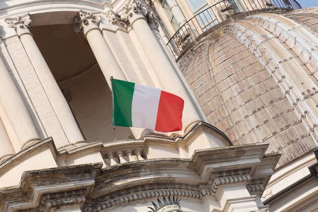 Rome: Italian flag on church in days of COVID-19 Italian flags on the Church of Sant Agnese in Agone and on some balconies in a Piazza Navona without people, on the morning of Sunday 22 March 2020, during the Covid-19 pandemic Roma Italy Copyright: MatteoxNardone