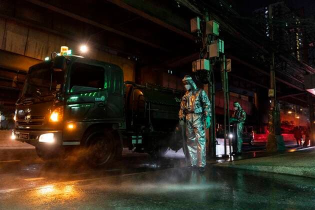 March 22, 2020, Bangkok, Bangkok, Thailand: Members of the Royal Thai Army have conducted sanitization activities in Bangkok nightly since March 19th in an effort to slow the spread of the Covid-19 virus, descending on areas of the city that see heavy pedestrian traffic. Wearing protective suits the soldiers and volunteers spray the sidewalks with chemical disinfectant and also clean high touch surfaces such as guard rails and ATM machines. Thailand s number of confirmed Covid-19 cases rose to 599, an increase of 188 from the day prior, the largest 1 day increase the country has seen so far. Bangkok Thailand - ZUMAt128 20200322_zap_t128_010 Copyright: xAdryelxTalamantesx