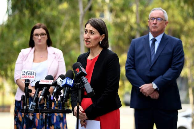 GLADYS BEREJIKLIAN CORONAVIRUS PRESSER, NSW Premier Gladys Berejiklian (centre) NSW Minister for Health Brad Hazzard (right) and NSW Minister for Education Sarah Mitchell speak to the media in Sydney, Monday, March 23, 2020. The state of NSW is shutting down all non-essential services to slow the rapidly spreading coronavirus but schools will stay open for now. ( NO ARCHIVING, EDITORIAL USE ONLY, NO USE IN BOOKS WITHOUT CONSENT SYDNEY NSW AUSTRALIA  Copyright: xJOELxCARRETTx 20200323001458832499