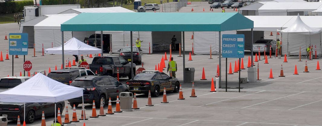 MIAMI GARDENS, FL - MARCH 22: FIRST RESPONDERS ONLY TESTING DAY - Instead of setting up for the Miami Open tennis tournament, the Florida National Guard (many without face masks due to shortage) was running a drive-through testing site off the Florida Turnpike at the Hard Rock Stadium in Miami Gardens where people can go for a COVID-19 Test Without Getting out of their Cars. As Miami-Dade Countys number of COVID-19 cases rise to 169, the site will open at 9 a.m. Monday in the east parking lot of the Hard Rock Stadium, 347 Don Shula Drive. The testing is free and the site will be open from 9 a.m. to 5 p.m. on a daily basis, said Juan Diasgranados, a spokesperson for the testing site. The test site will be run and was created by several local, state and national agencies which include FEMA, the CDC, Florida Department of Health, Florida A - ZUMAs214 20200323_zba_s214_015 Copyright: xSMGx