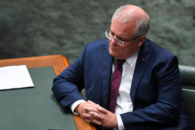 CORONAVIRUS LEGISLATION PARLIAMENT, Australian Prime Minister Scott Morrison attends a parliamentary sitting under rules of social distancing in the House of Representatives at Parliament House in Canberra, Monday, March 23, 2020. ( NO ARCHIVING, EDITORIAL USE ONLY, NO USE IN BOOKS WITHOUT CONSENT CANBERRA ACT AUSTRALIA  Copyright: xLUKASxCOCHx 20200323001458842761