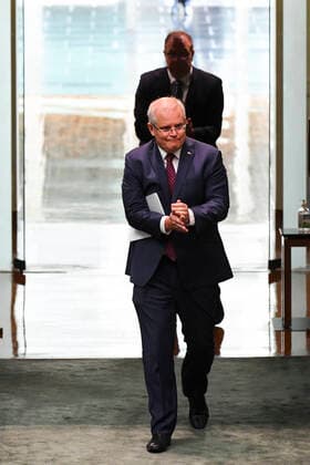 CORONAVIRUS LEGISLATION PARLIAMENT, Australian Prime Minister Scott Morrison uses hand sanitizer as he attends a parliamentary sitting under rules of social distancing in the House of Representatives at Parliament House in Canberra, Monday, March 23, 2020. ( NO ARCHIVING, EDITORIAL USE ONLY, NO USE IN BOOKS WITHOUT CONSENT CANBERRA ACT AUSTRALIA  Copyright: xLUKASxCOCHx 20200323001458843033