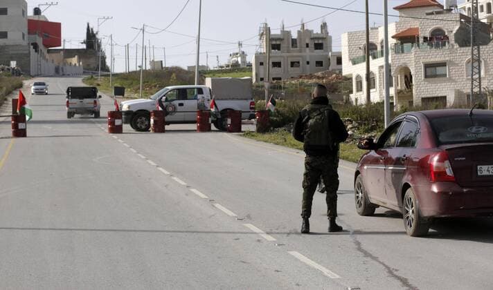March 23, 2020, Nablus, West Bank, Palestinian Territory: Palestinian policemen stand at the streets during of a mandatory quarantine that was announced by the Palestinian Authority as part of measures against the COVID-19 coronavirus pandemic, in the West Bank city of Nablus on March 23, 2020. The Palestinian Health Ministry today reported its first two cases of the novel coronavirus in the Gaza Strip. undertook serious measures to preempt the arrival of the virus to the strip. Up until its decision to seal off its sides of the Rafah crossing with Egypt and the Erez checkpoint with Israel, hundreds of Palestinians who entered the strip were immediately quarantined to ensure they had no symptoms of the disease Nablus Palestinian Territory - ZUMAap3_ 20200323_zaf_ap3_038 Copyright: xShadixJarar Ahx