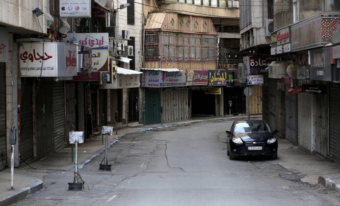March 23, 2020, Nablus, West Bank, Palestinian Territory: A view of closed stores as a preventive measure against the coronavirus during of a mandatory quarantine that was announced by the Palestinian Authority as part of measures against the COVID-19 coronavirus pandemic, in the West Bank city of Nablus on March 23, 2020. The Palestinian Health Ministry today reported its first two cases of the novel coronavirus in the Gaza Strip. undertook serious measures to preempt the arrival of the virus to the strip. Up until its decision to seal off its sides of the Rafah crossing with Egypt and the Erez checkpoint with Israel, hundreds of Palestinians who entered the strip were immediately quarantined to ensure they had no symptoms of the disease Nablus Palestinian Territory - ZUMAap3_ 20200323_zaf_ap3_042 Copyright: xShadixJarar Ahx