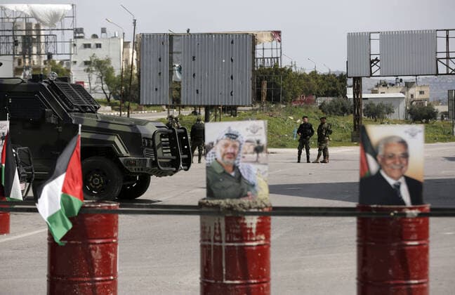 March 23, 2020, Nablus, West Bank, Palestinian Territory: Palestinian policemen stand at the streets during of a mandatory quarantine that was announced by the Palestinian Authority as part of measures against the COVID-19 coronavirus pandemic, in the West Bank city of Nablus on March 23, 2020. The Palestinian Health Ministry today reported its first two cases of the novel coronavirus in the Gaza Strip. undertook serious measures to preempt the arrival of the virus to the strip. Up until its decision to seal off its sides of the Rafah crossing with Egypt and the Erez checkpoint with Israel, hundreds of Palestinians who entered the strip were immediately quarantined to ensure they had no symptoms of the disease Nablus Palestinian Territory - ZUMAap3_ 20200323_zaf_ap3_062 Copyright: xShadixJarar Ahx