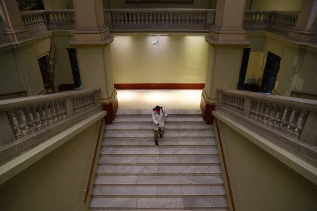 (200323) -- CAIRO, March 23, 2020 -- A man sprays disinfectant at the Egyptian Museum in downtown Cairo, Egypt, March 23, 2020. Egypt confirmed on Sunday 33 new COVID-19 cases, raising the total cases in the country to 327, the Egyptian Health Ministry said in a statement. The Egyptian Ministry of Tourism and Antiquities announced on Saturday the shutting down of all museums and archeological sites and attractions nationwide from March 23 to 31 for sterilization. (Photo by Ahmed Gomaa Xinhua) EGYPT-CAIRO-EGYPTIAN MUSEUM-COVID-19-MEASURES WuxHuiwo 