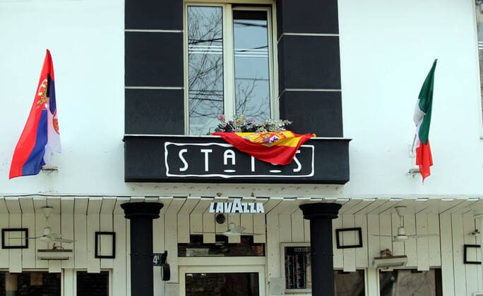 23.03.2020 Belgrade(Serbia) Life pandemia corona virus Cafe status closed by decision of Serbian government of state of emergency of corona virus in Belgrade community Zemun. With flags of Spain and Italy in solidarity with their victims of corona virus.Serbia like country from today has 249 infected persons of corona virus and two dead case. 