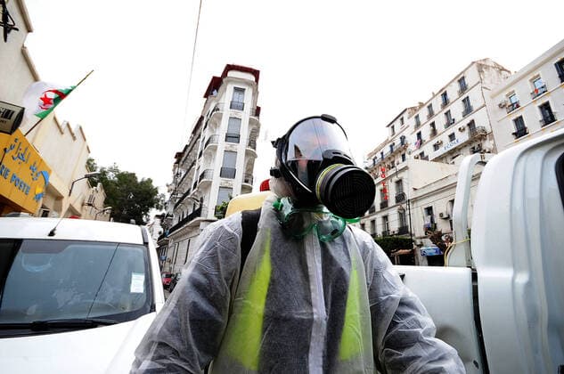 COVID-19 Algeria , Algiers , March 23, 2020 A man disinfects a street of Algiers, Monday, March 23, 2020.Algeria reported a new death from COVID-19 .  Copyright: KADRIxMohamed