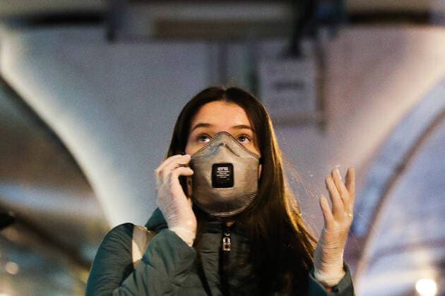 MOSCOW, RUSSIA - MARCH 23, 2020: A woman wears a face mask outside Vnukovo International Airport, amid the ongoing COVID-19 pandemic. Mikhail Tereshchenko TASS  TS0D32A7