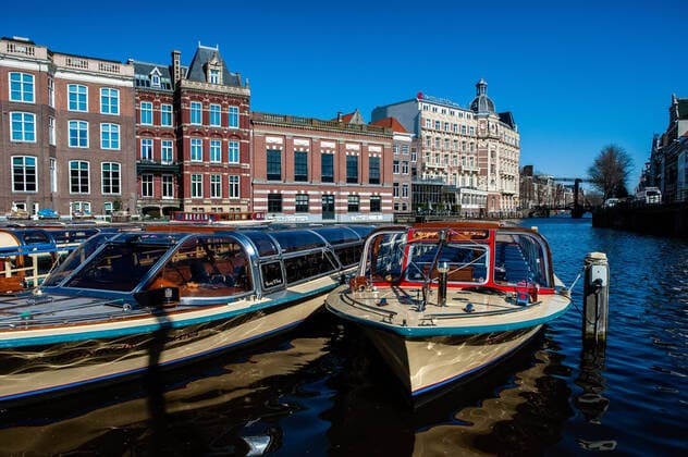 March 23, 2020, Amsterdam, Netherlands: Tourism boats are seen deserted due to the spread of the coronavirus..Since the Coronavirus hit The Netherlands, most of the cities are empty. A couple of weeks ago, Prime Minister Mark Rutte called to work from home as much as possible and also announced the closure of restaurants, sports clubs, sex clubs, saunas, and cafes. Amsterdam is not formally in lockdown, but the streets and squares are empty. Amsterdam Netherlands - ZUMAs197 20200323_zaa_s197_064 Copyright: xAnaxFernandezx