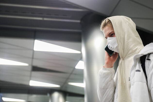 MOSCOW, RUSSIA - MARCH 23, 2020: A man wears a face mask and gloves at Vnukovo International Airport, amid the ongoing COVID-19 pandemic. Mikhail Tereshchenko TASS  TS0D32BC