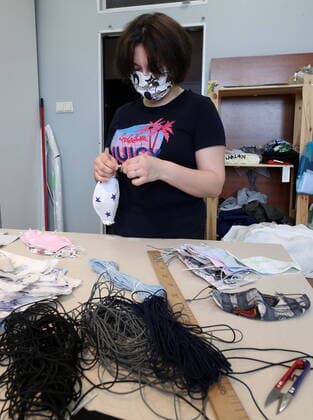 KAZAN, RUSSIA - MARCH 23, 2020: Making reusable face masks at the Chudo Mamy Wonder Moms sewing shop employing mothers of large families and mothers of children with challenges. Yegor Aleyev TASS  TS0D323C